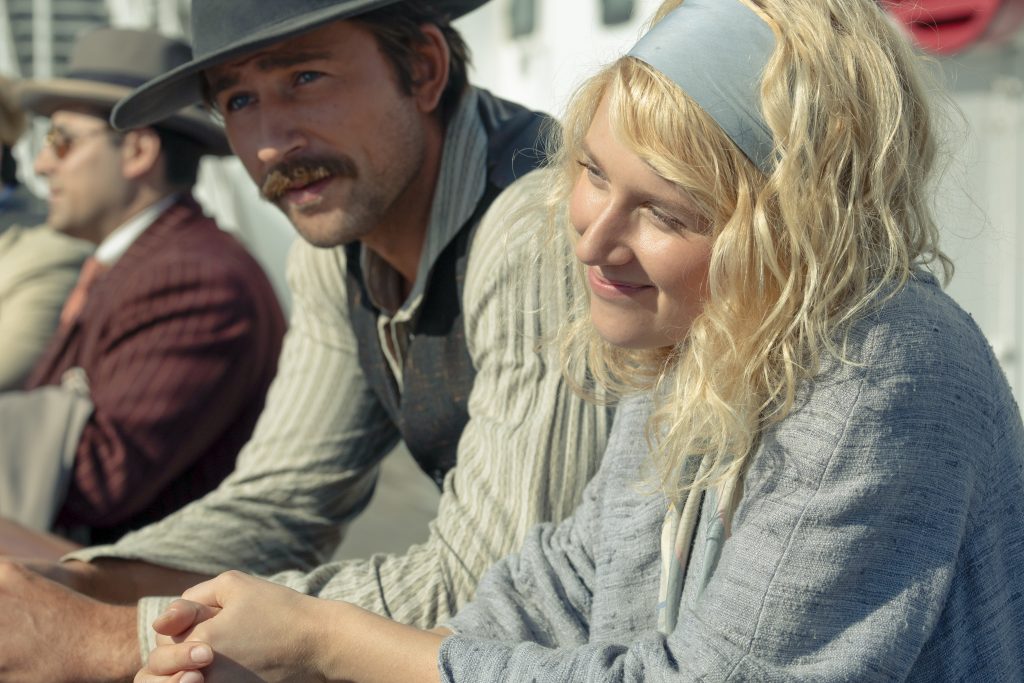 Brandon Sklenar as Spencer and Julia Schlaepfer as Alexandra in "1923"