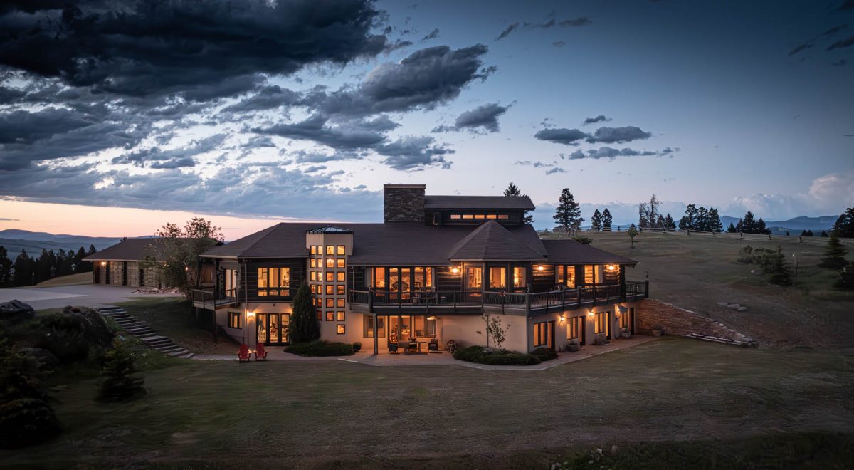 Exterior of Montana's Kokopelli Ranch against the Montana sunset.