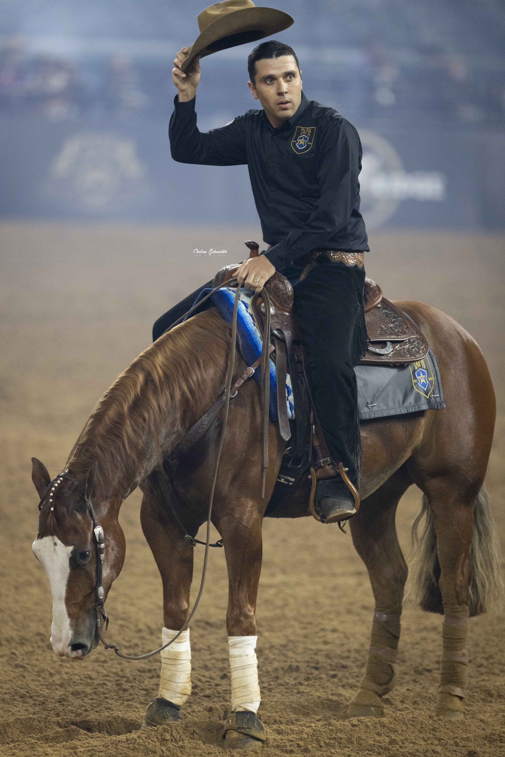 Fernando Salgado tips his hat to the crowd while in the arena during the 2023 American Performance Horseman competition.