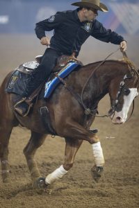 Fernando Salgado competes in a reining competition during the 2023 American Performance Horseman competition.