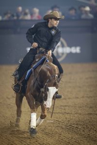 Fernando Salgado competes in a reining competition during the 2023 American Performance Horseman competition.