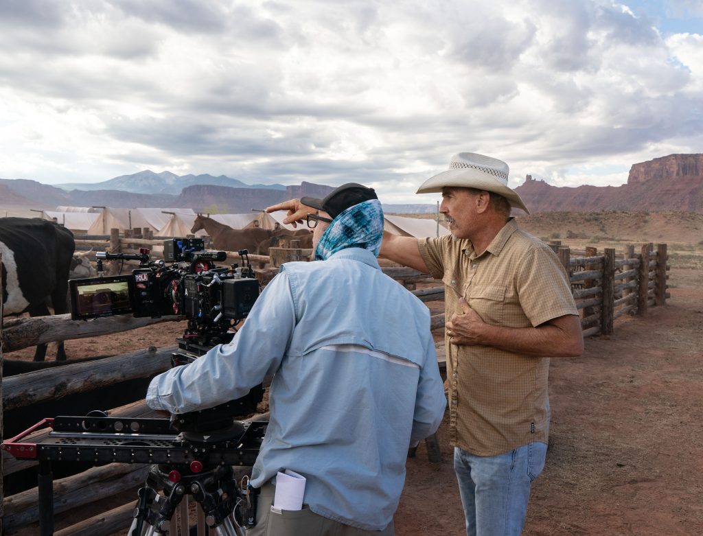 Kevin Costner directs a cameraman on the set of "Horizon."