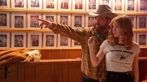 Paul Walter Hauser and Sydney Sweeney in "Americana"