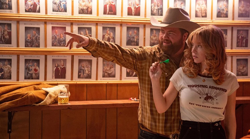 Paul Walter Hauser and Sydney Sweeney in "Americana"