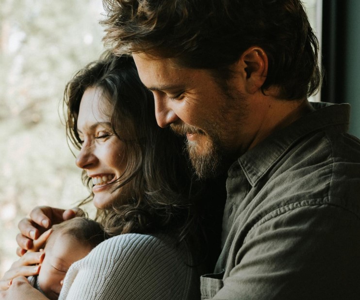 Luke Grimes, Bianca Rodrigues Grimes and their son.