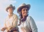 Actors Elizabeth Taylor and Rock Hudson smile while on horseback for the 1956 film "Giant."